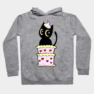 Funny Black cat jumping out of a cake Hoodie